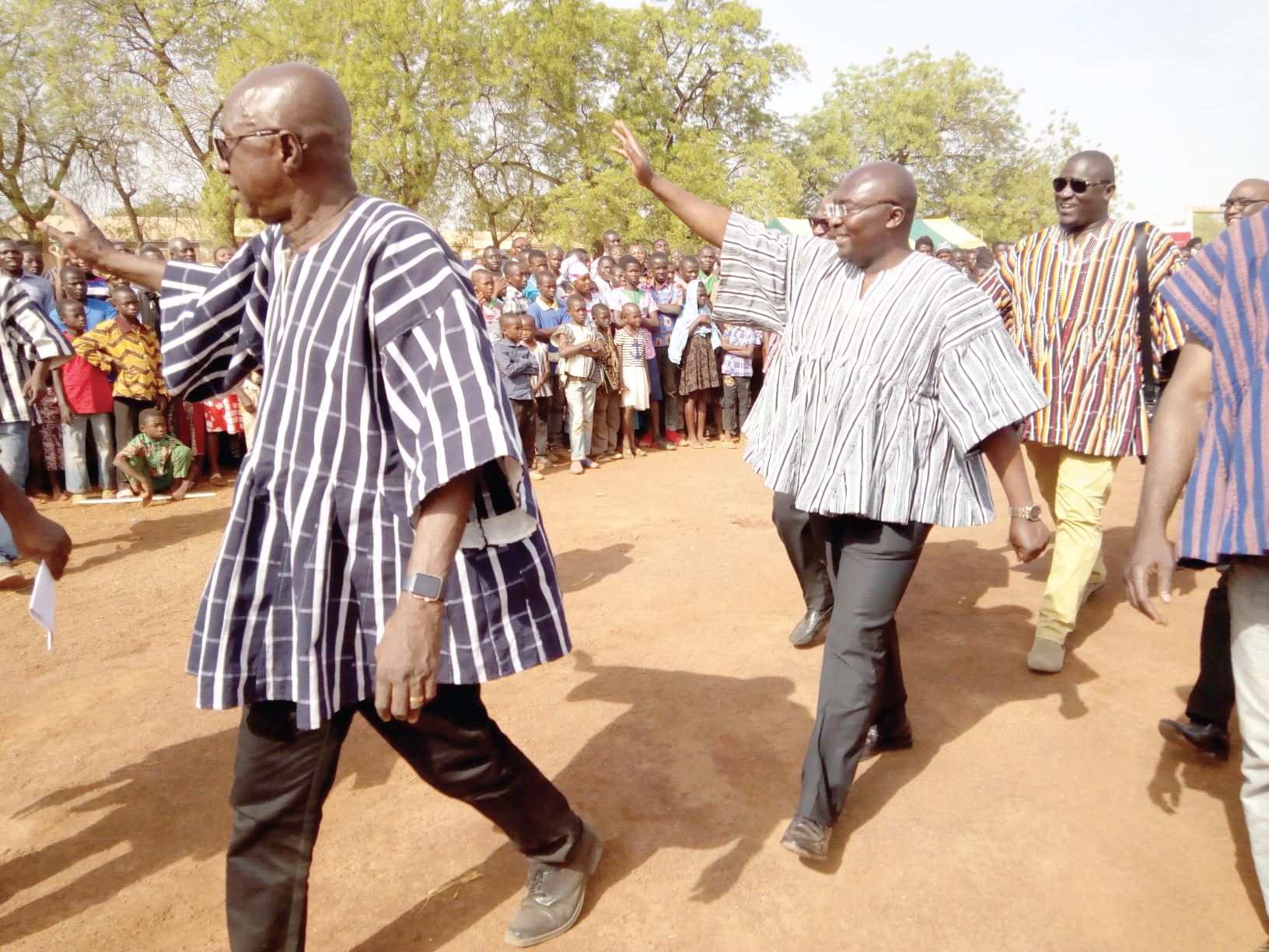  Vice-President Mahamudu Bawumia (2nd left), Mr Ambrose Dery (left), the Minister for the Interior, and some members of their entourage acknowledging cheers from the crowd on their arrival at the durbar  to mark the Kakube Festival. 